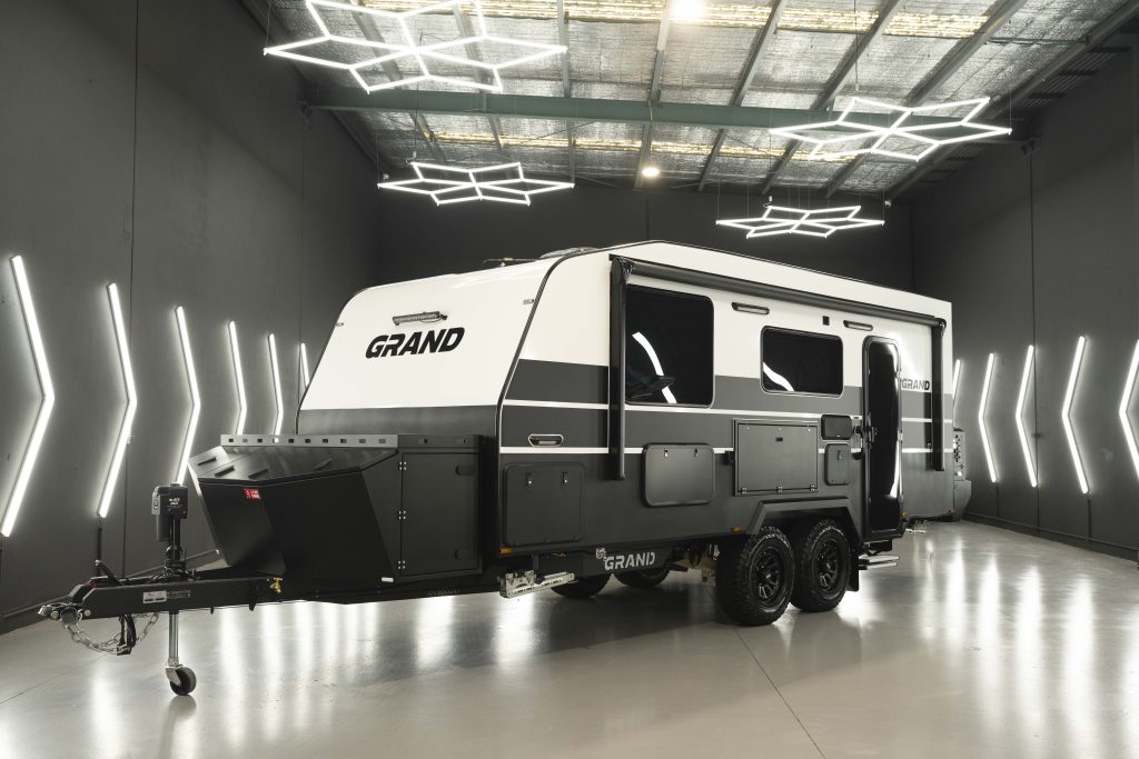 A Grand Caravan in a fluorescent lit showroom